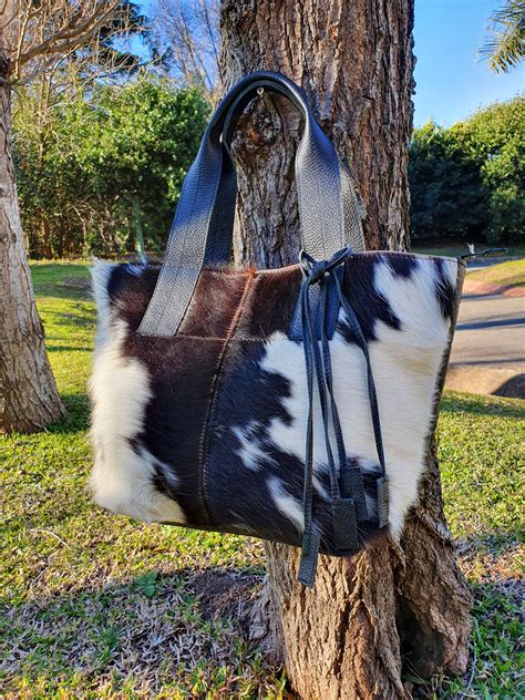 fake cowhide bag|genuine cowhide handbags.